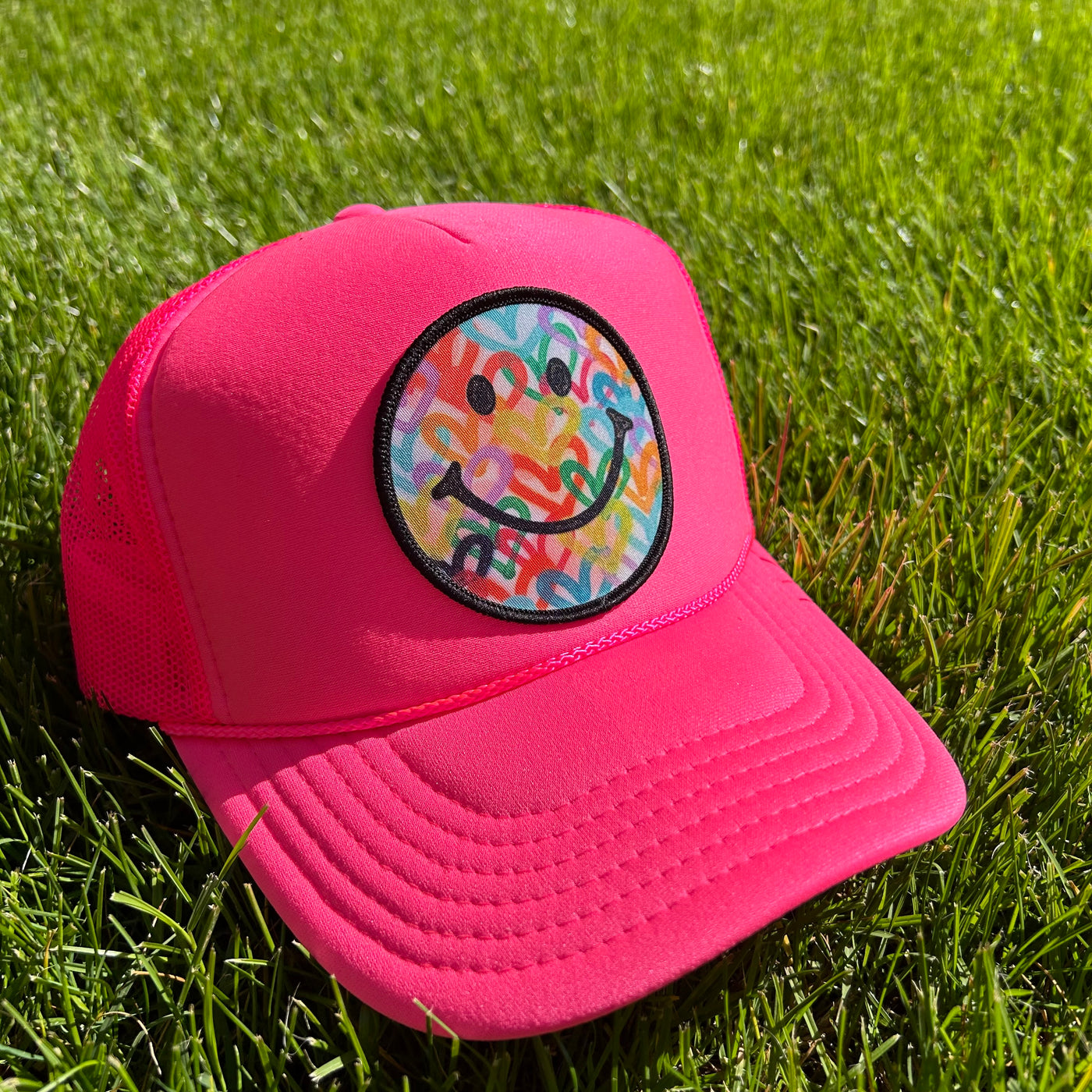 “Solid Pink Neon Smiley" Trucker Hat