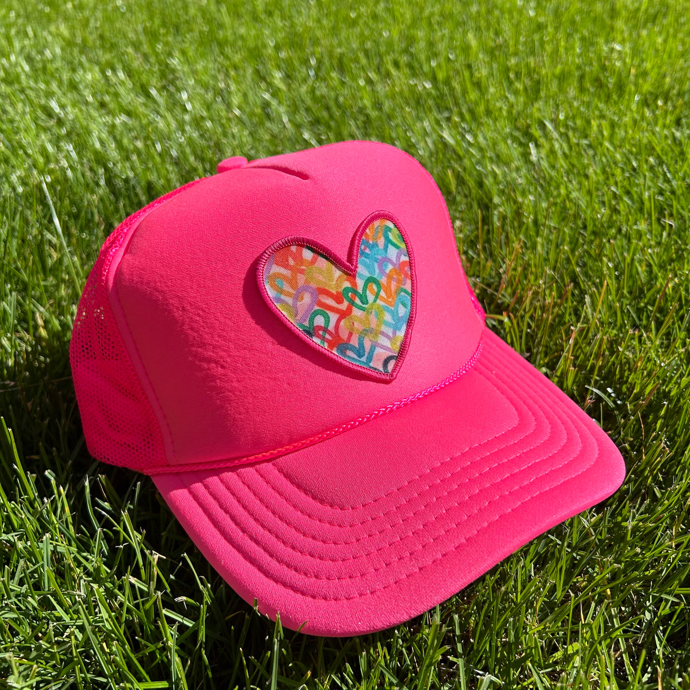 “Solid Pink Neon Heart" Trucker Hat