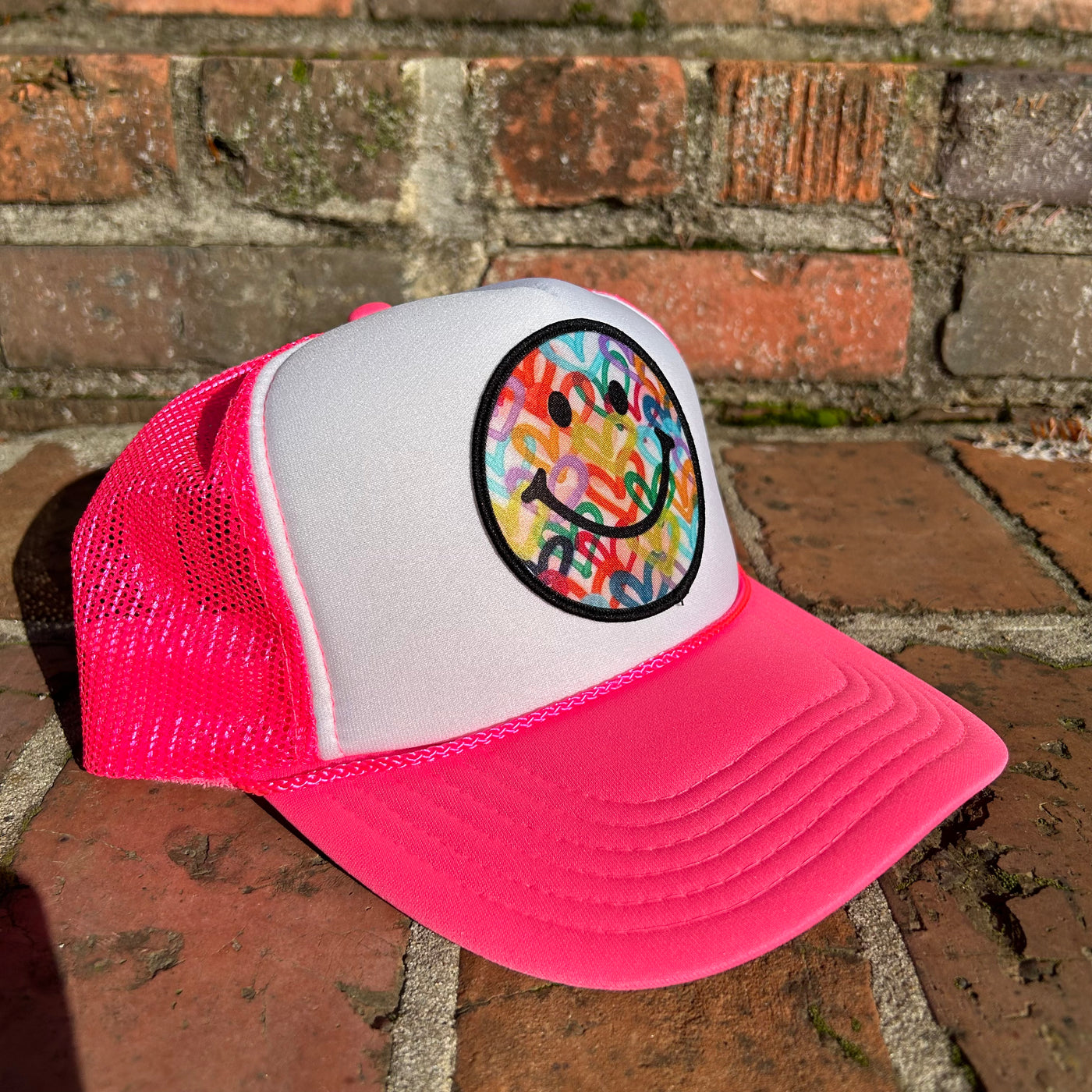 “Neon Pink Smiley" Trucker Hat